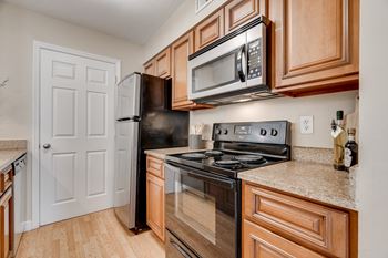 Kitchen With Black & Stainless Steel Appliances